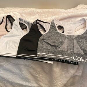 4 Calvin Klein reversible sports bras size medium.